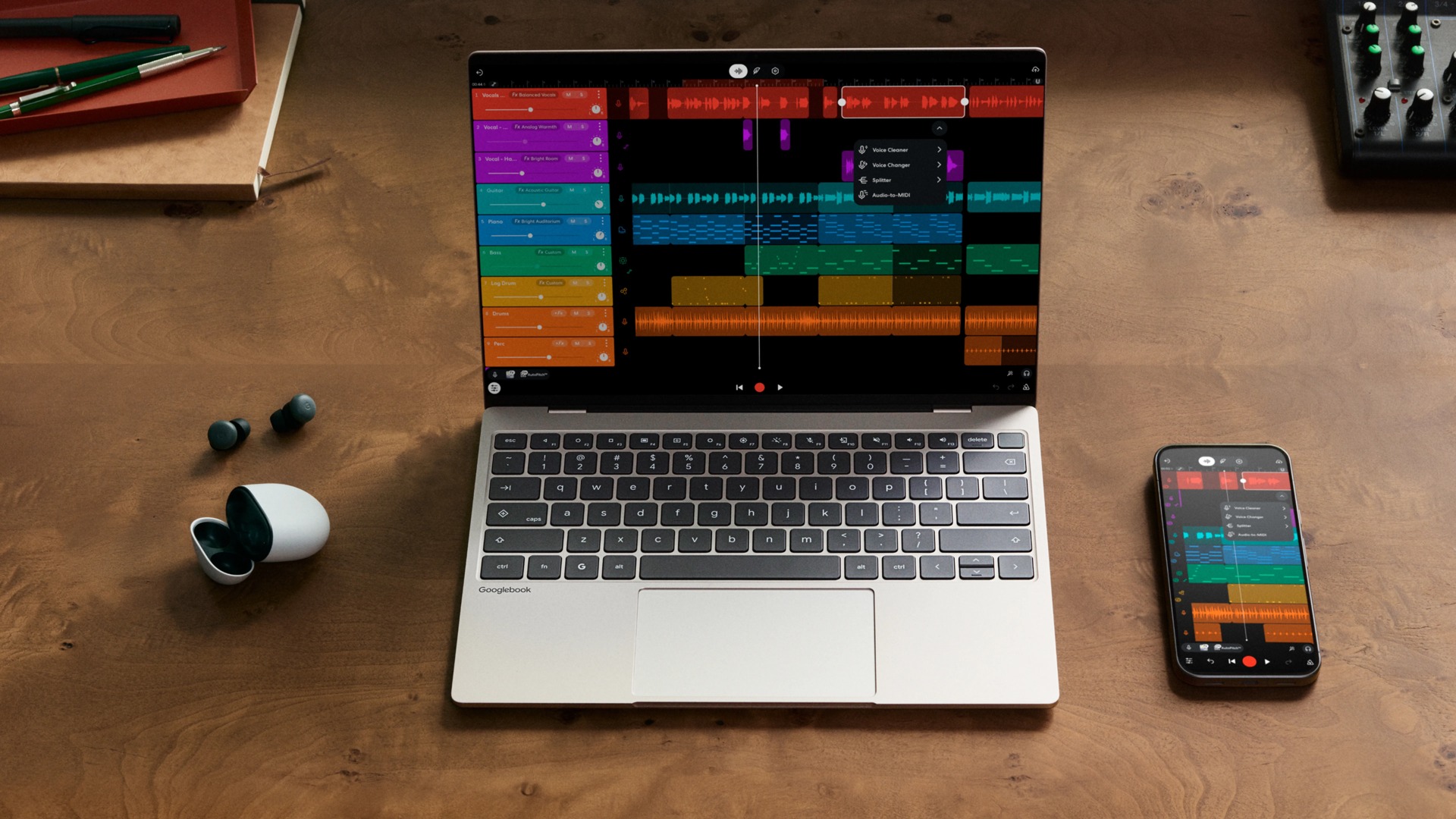 Googlebook laptop and Android phone displaying a music app in Google's official demonstration.