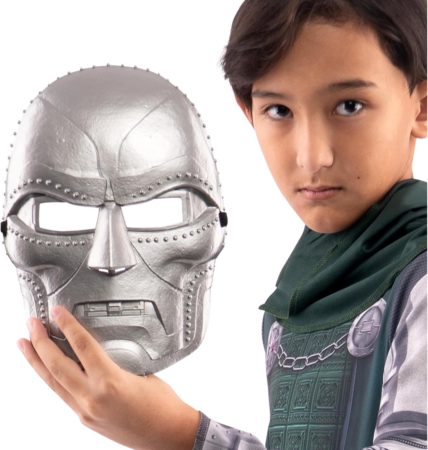 Catalog model holding the silver-colored Doctor Doom mask beside the youth costume.