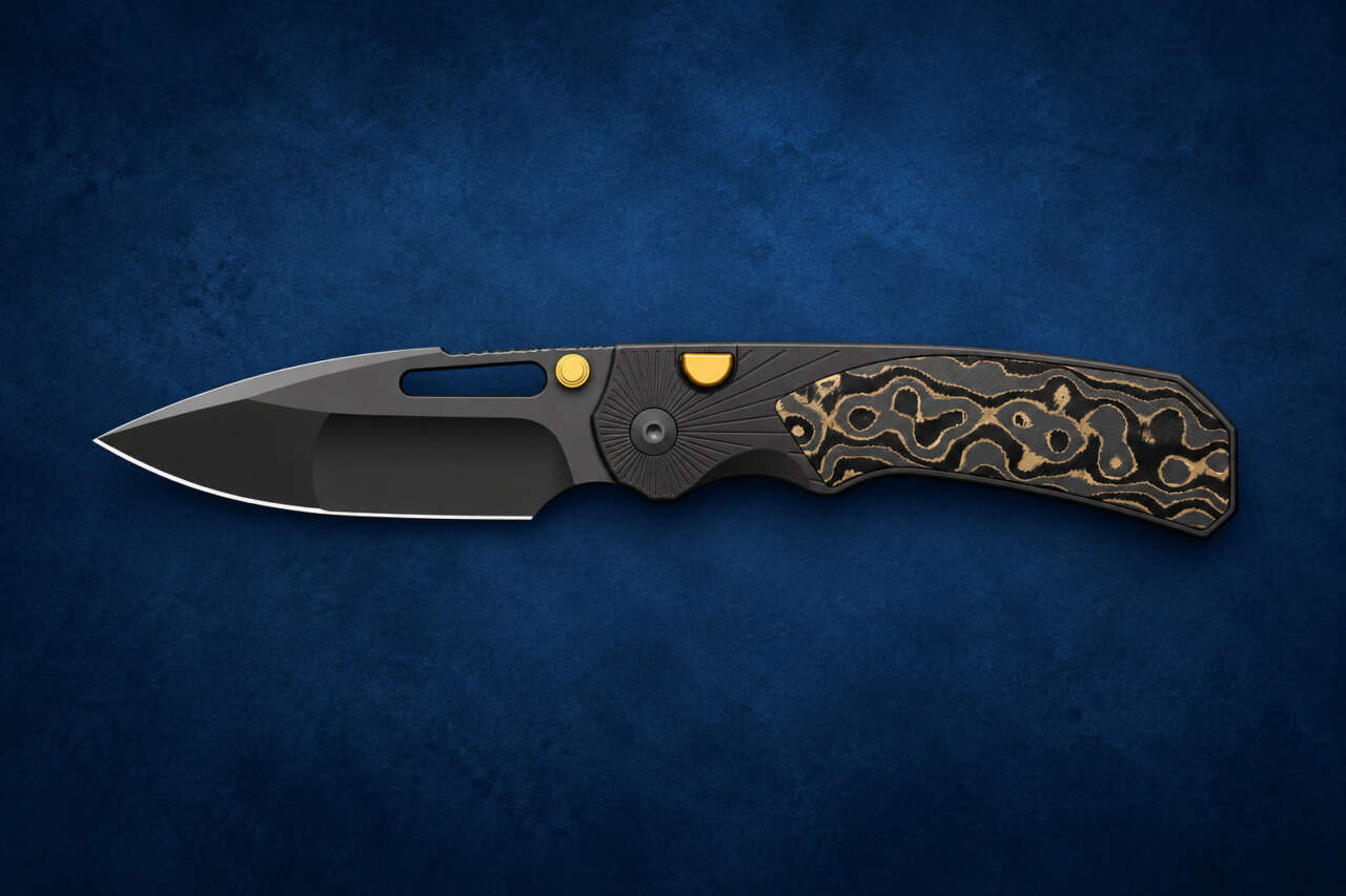 Kizer Durandal Camo Gold pocket knife on a dark blue editorial background