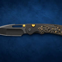 Kizer Durandal Camo Gold pocket knife on a dark blue editorial background