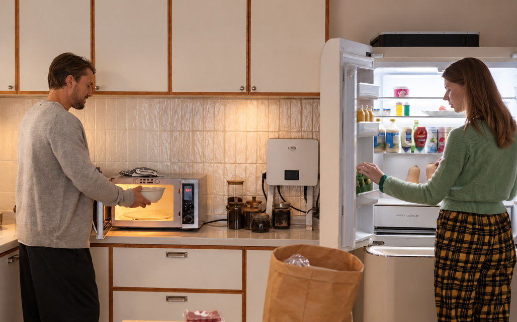 Lares K1 beside a refrigerator and microwave in LiTime’s supplied kitchen scene