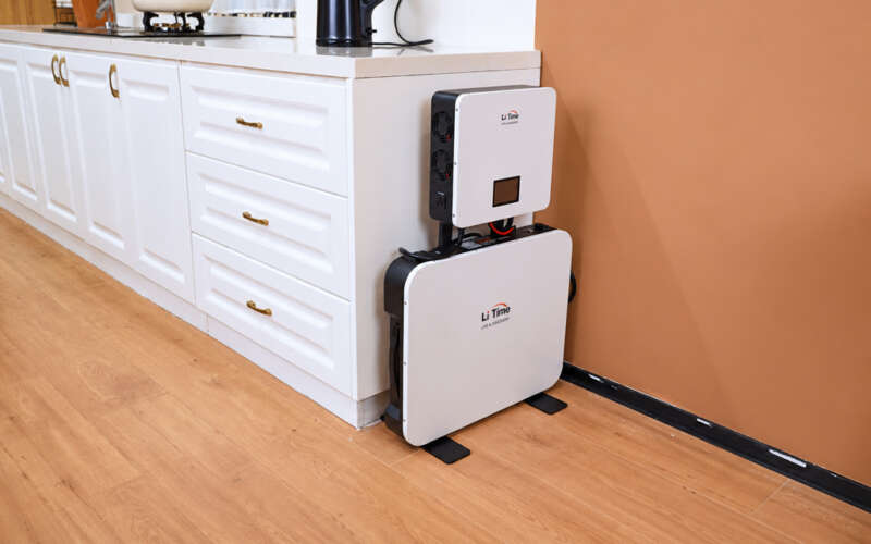 LiTime Lares K1 standing beside kitchen cabinets in the supplied lifestyle photograph