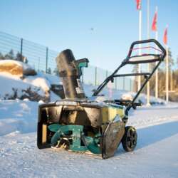 Makita SN001G snow blower outdoors in snow