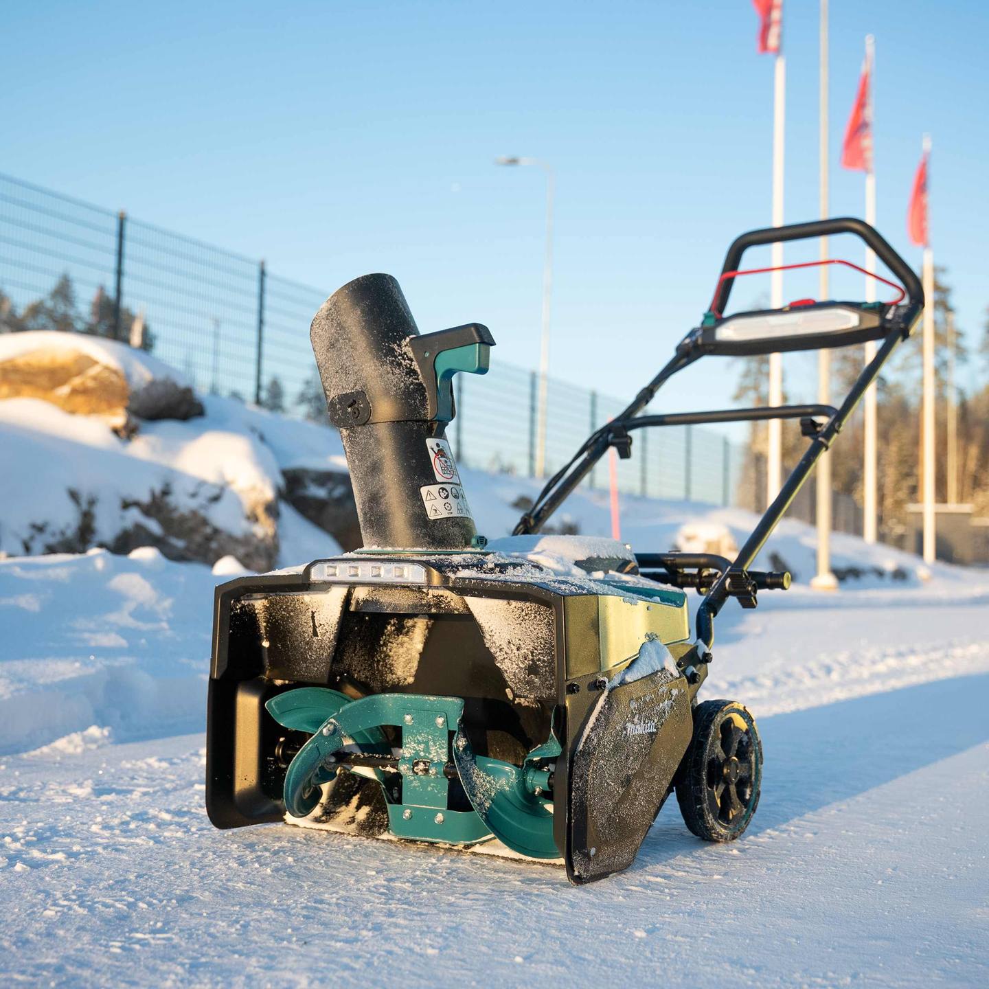 Makita SN001G snow blower outdoors in snow