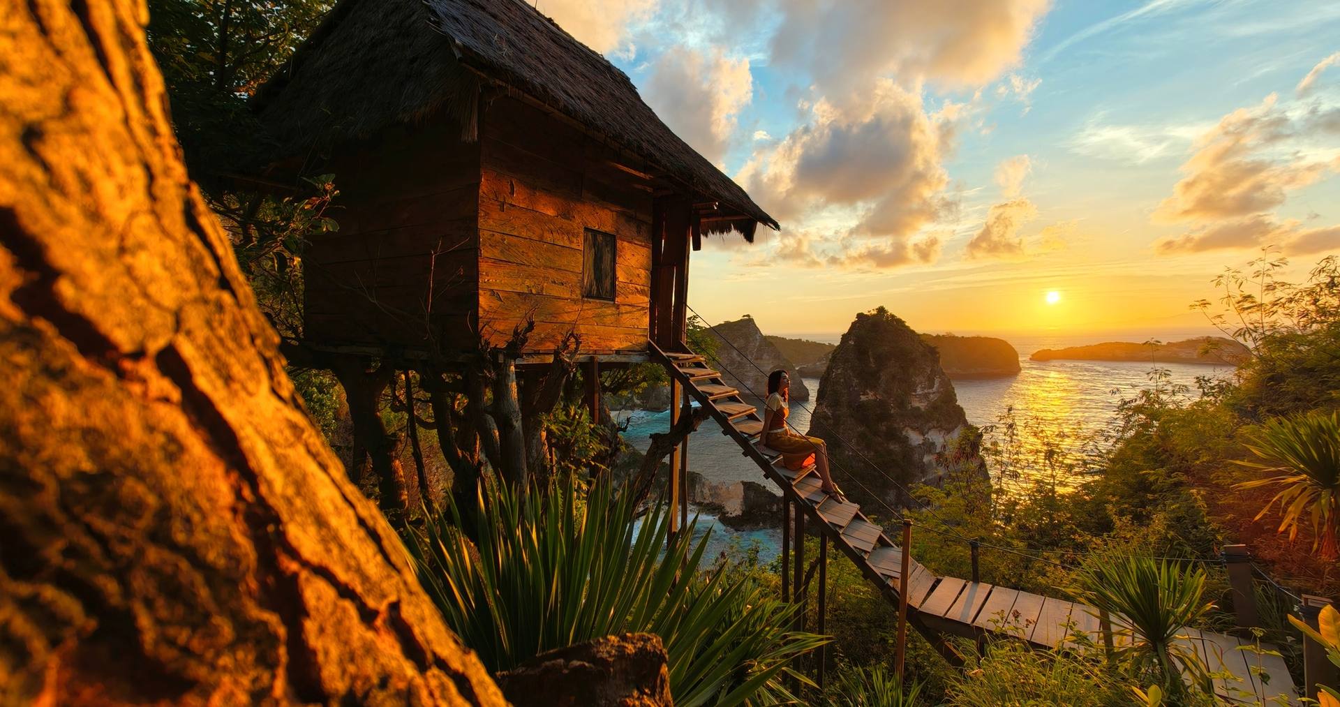 OPPO camera illustration of a coastal hut and steps at sunset