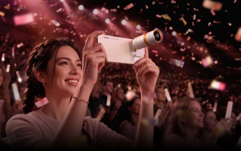 OPPO illustration showing the Find X10 Pro Max with its optional Hasselblad teleconverter at a concert