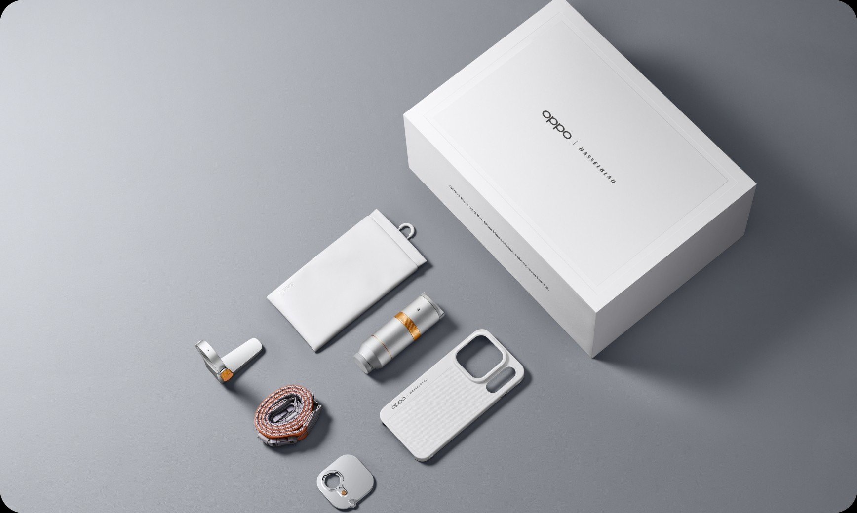 OPPO Find X10 Pro Max Hasselblad teleconverter kit and accessories arranged on a gray surface