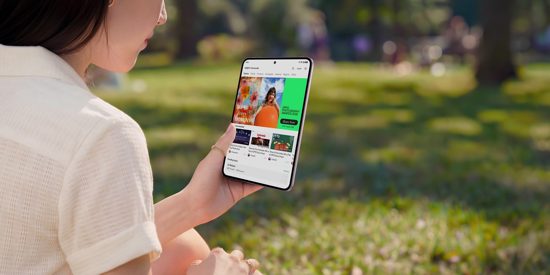 A woman holding the OPPO Pad Mini Matte Display Edition outdoors.