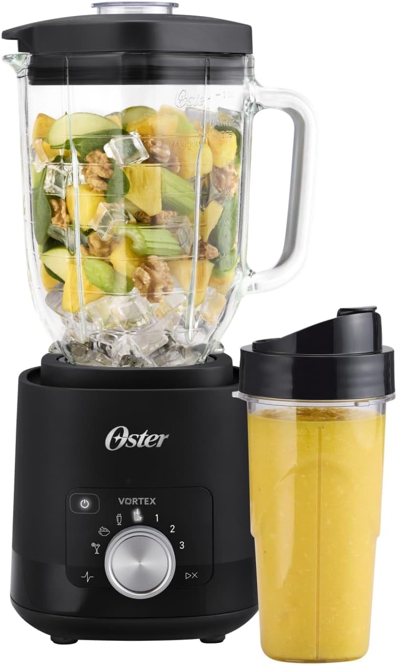 Black Oster Vortex Plus glass blender beside its included Blend-N-Go cup