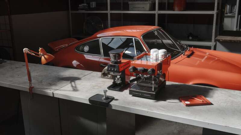 Tangerine Porsche x La Marzocco Linea Micra and Pico grinder beside a Carrera RS