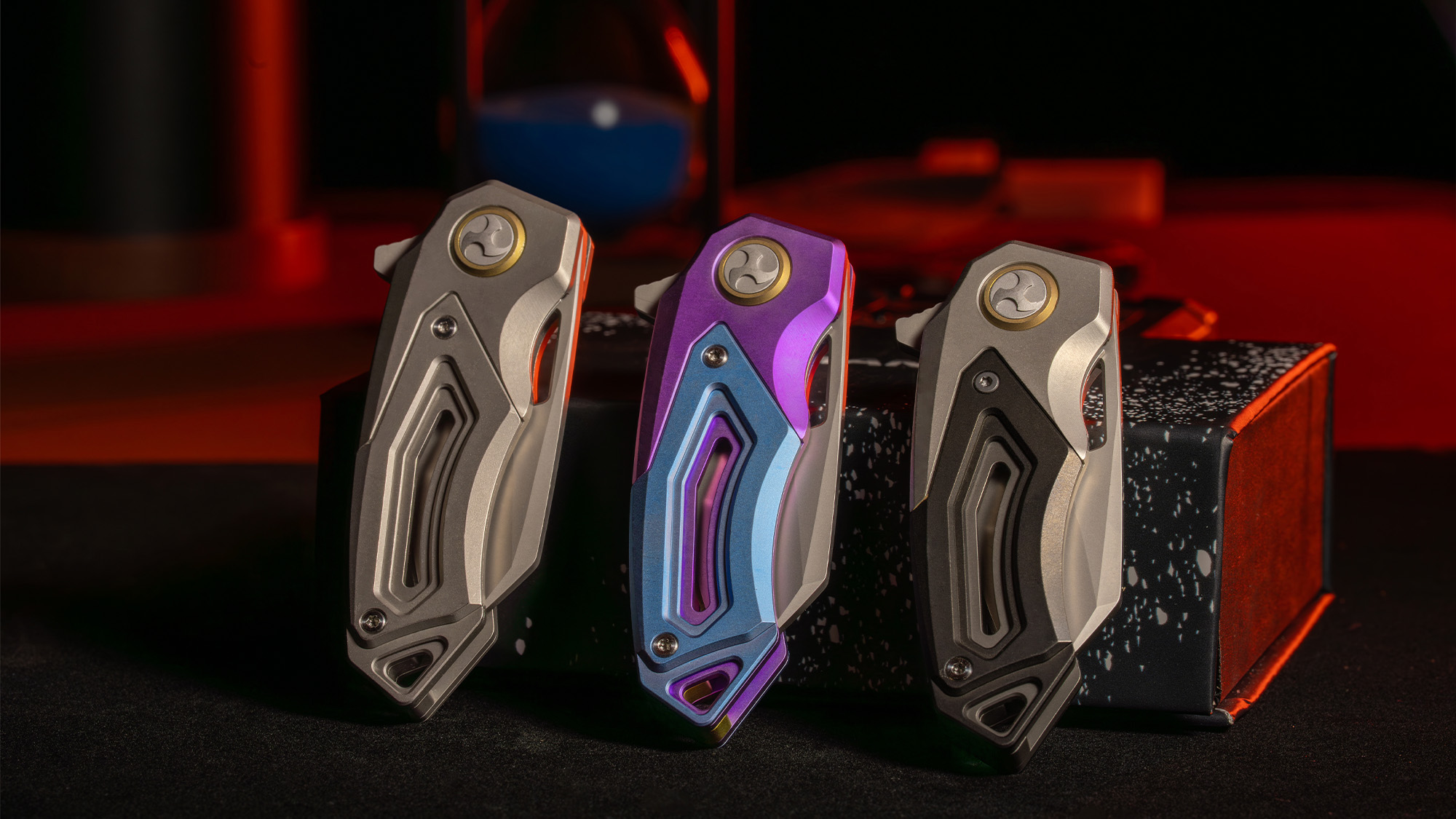 Three creator-supplied RAVEN-T handle finishes shown with blades closed