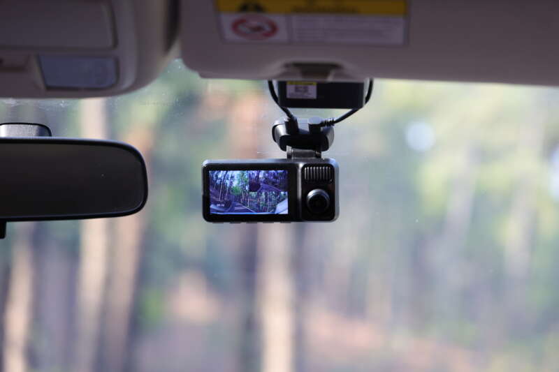 REDTIGER F17 Elite dash cam mounted beside a car's rearview mirror