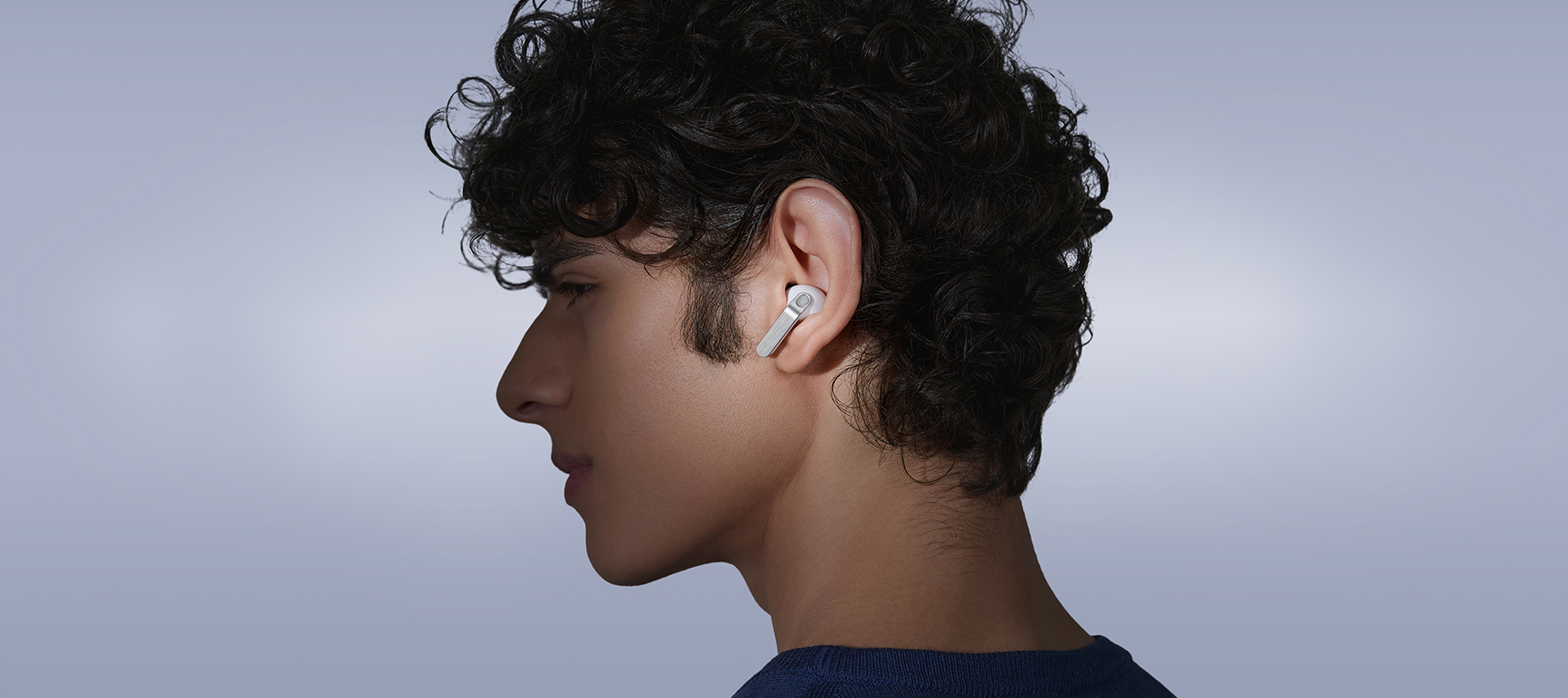 A person wearing white Samsung Galaxy Buds4 Pro