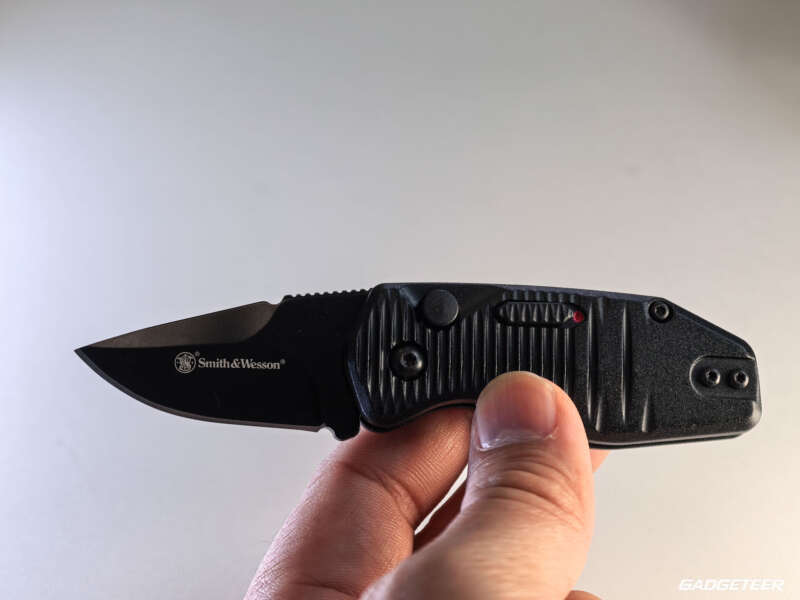 Open Smith & Wesson Special Ops knife held in hand