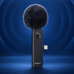 Sony ECM-AX10 microphone with its complete windscreen, USB-C connector and body on a dark blue acoustic-themed backdrop