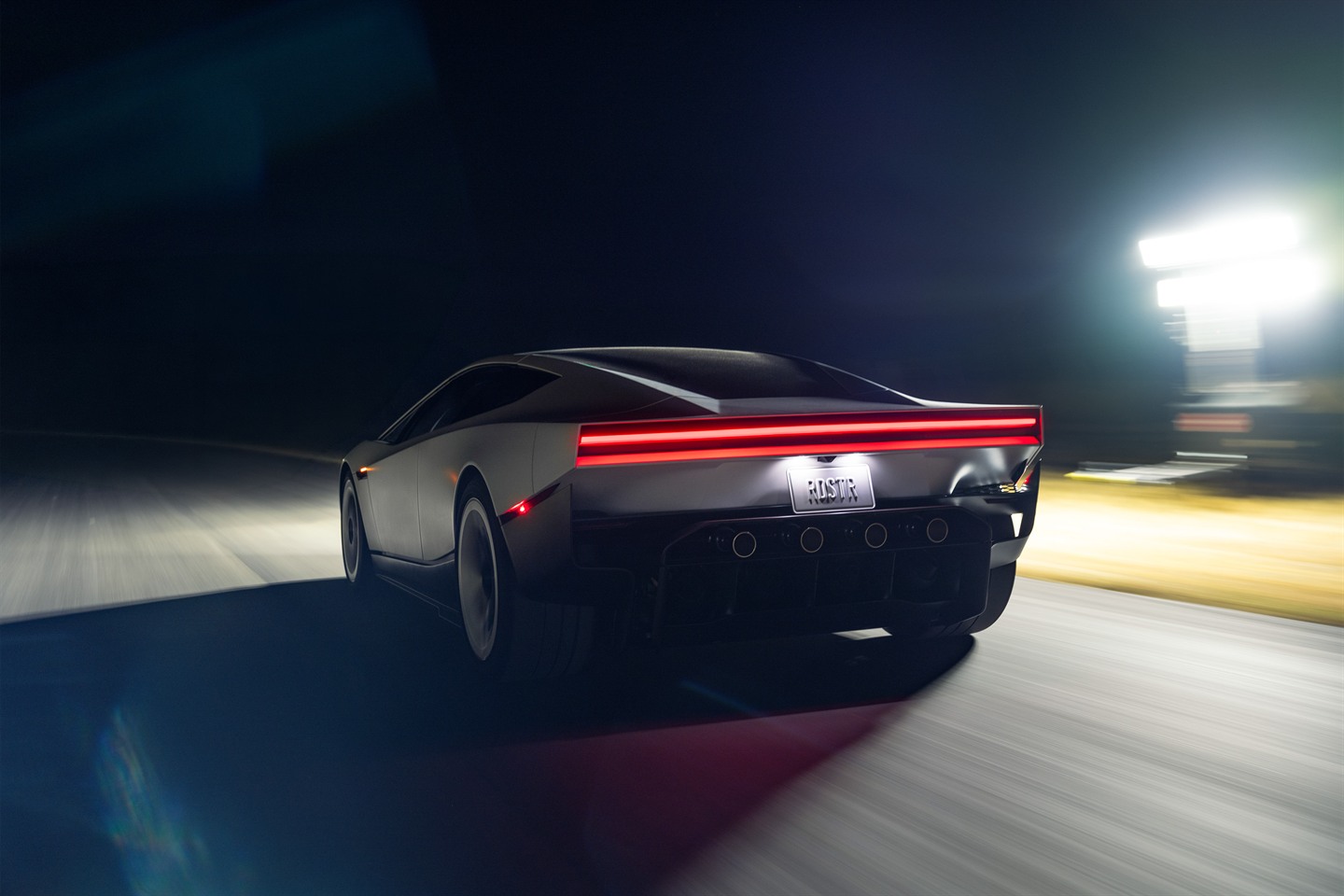 Tesla Roadster night driving depiction.