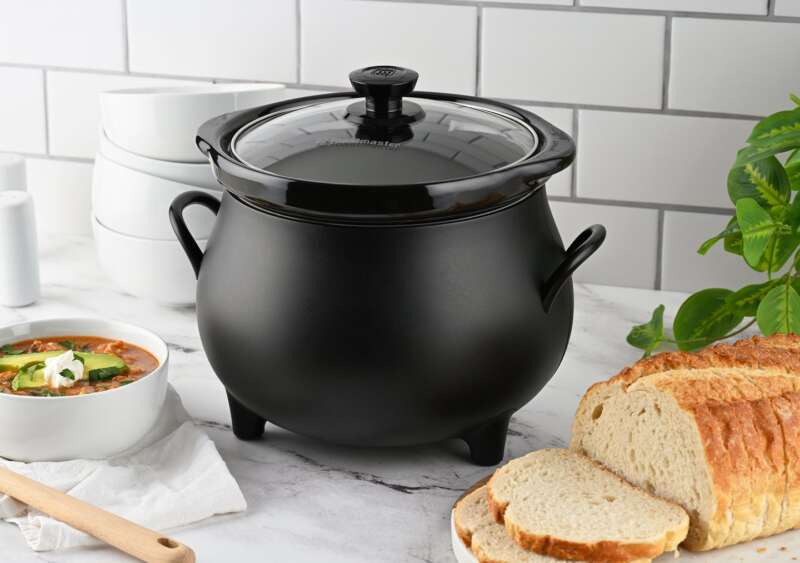 Toastmaster cauldron slow cooker with bread and soup on a kitchen counter.