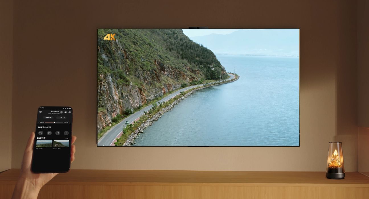 Phone casting a coastal landscape to a wall-mounted Huawei MateTV 2