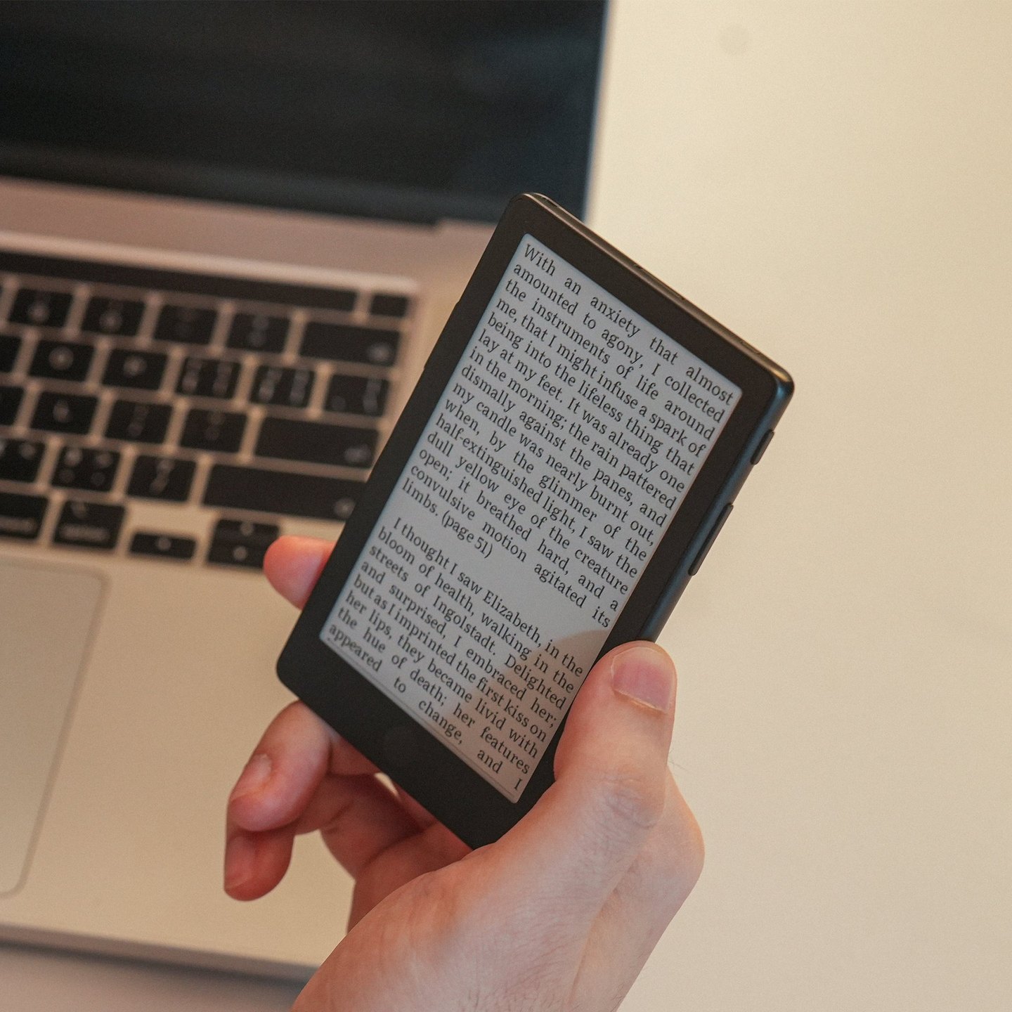 XTEINK X4 Pro held beside a laptop. Image: XTEINK.