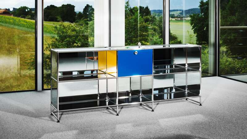 Mirrored USM Haller sideboard with the unique Zenith DEFY Chronograph USM TimeForArt watch in a glass-walled room